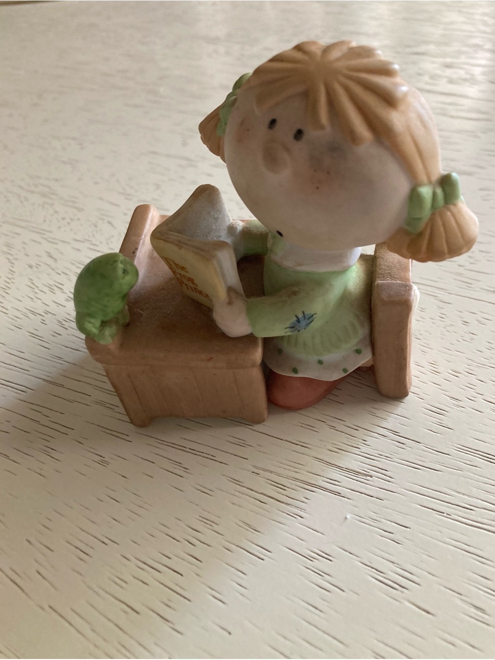 George Good Fabrizio Bumpkin Girl at desk reading to a little frog